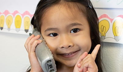 ContactDropdown Little girl on the phone